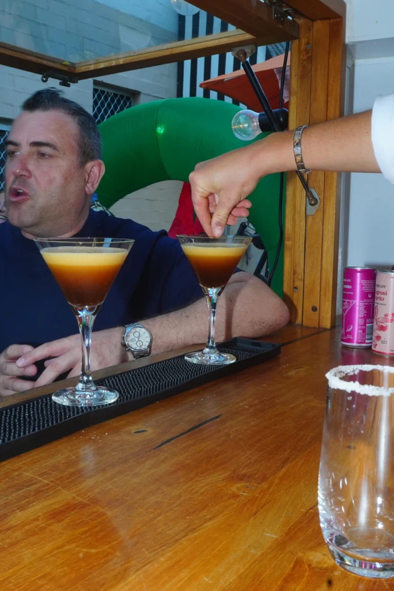 Guest enjoying a Roaming Rhythm cocktail