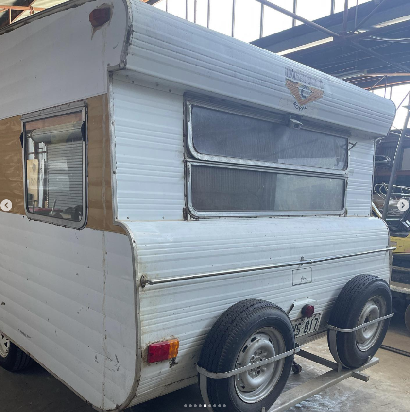 Side view of the vintage caravan before restoration